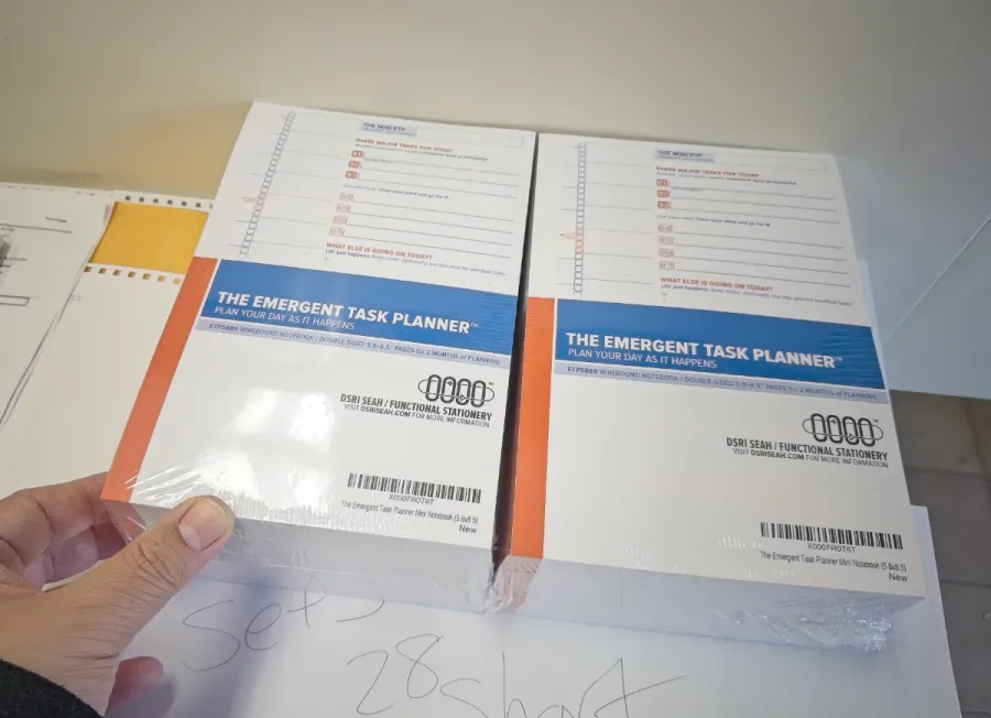 Two stacks of branding inserts which go into the packaging