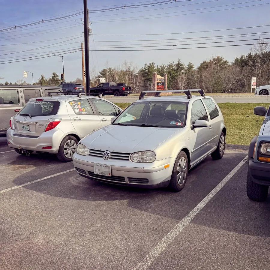 A 2000 GTI Mk4 in a mechanic's parking lot