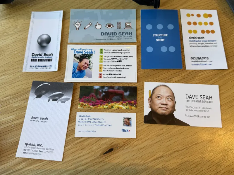 A table top covered with business cards from 1993 to 2019