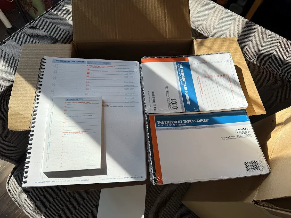 Samples of ETP products are arranged to show comparative size from 8.5x11 inch Full Sized ETP Notebooks to the 4x6 inch ETP StickyPads (full size image)