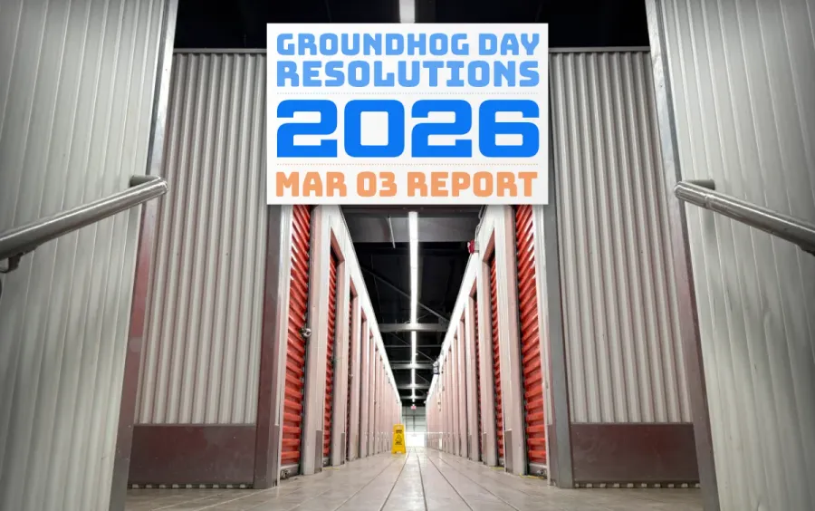 the inside of a U-Haul storage building, with an endless row of units fading into the distance