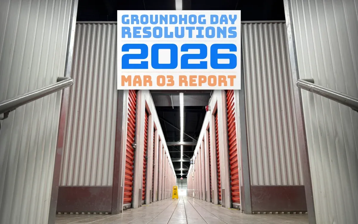 the inside of a U-Haul storage building, with an endless row of units fading into the distance (full size image)