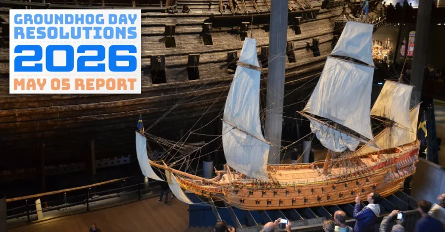 The preserved Swedish warship _Vasa_ in the Vasamuseum in Stockholm, next to a scale model surrounded by people.