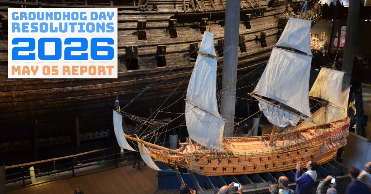 The preserved Swedish warship _Vasa_ in the Vasamuseum in Stockholm, next to a scale model surrounded by people. (full size image)