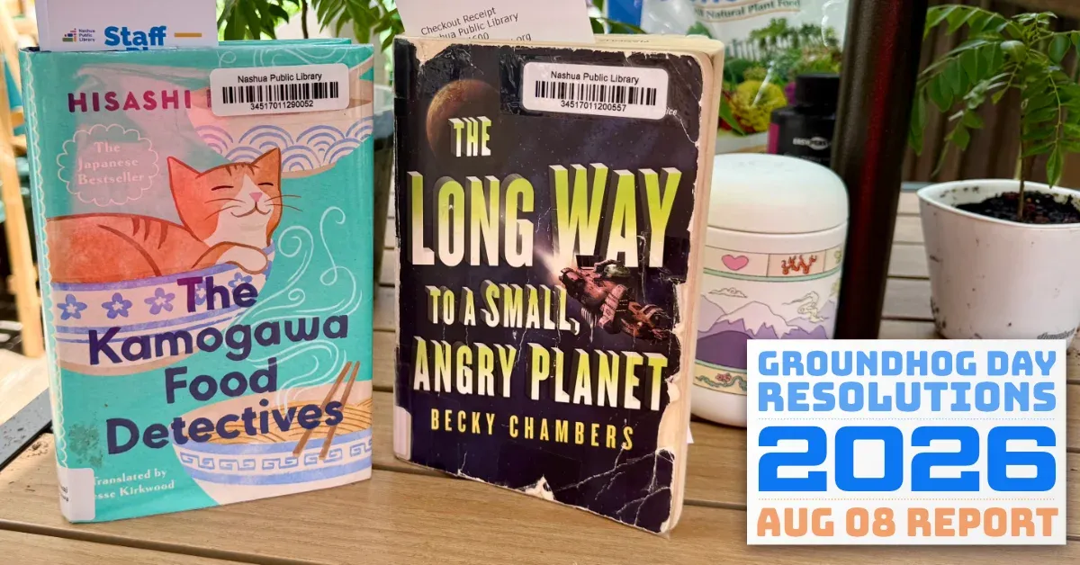 Two books on a table, 'The Kamogawa Food Detectives' and 'The Long Way to a Small, Angry Planet' (full size image)